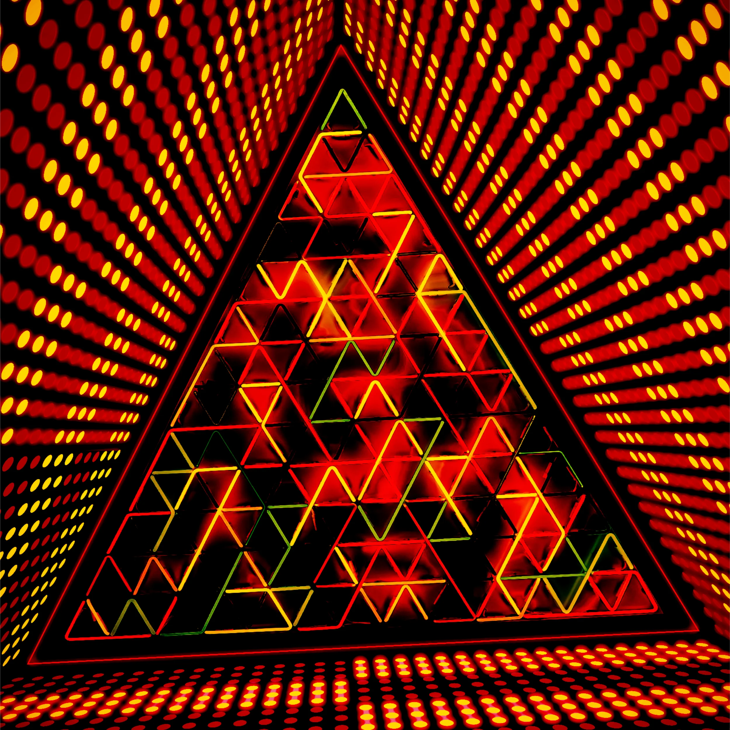 Triangular LED light display with vibrant red patterns