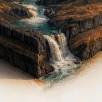 Zoom on the turquoise river carving through the valley