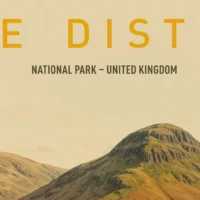 Stone bridge crossing a stream before it cascades into a waterfall